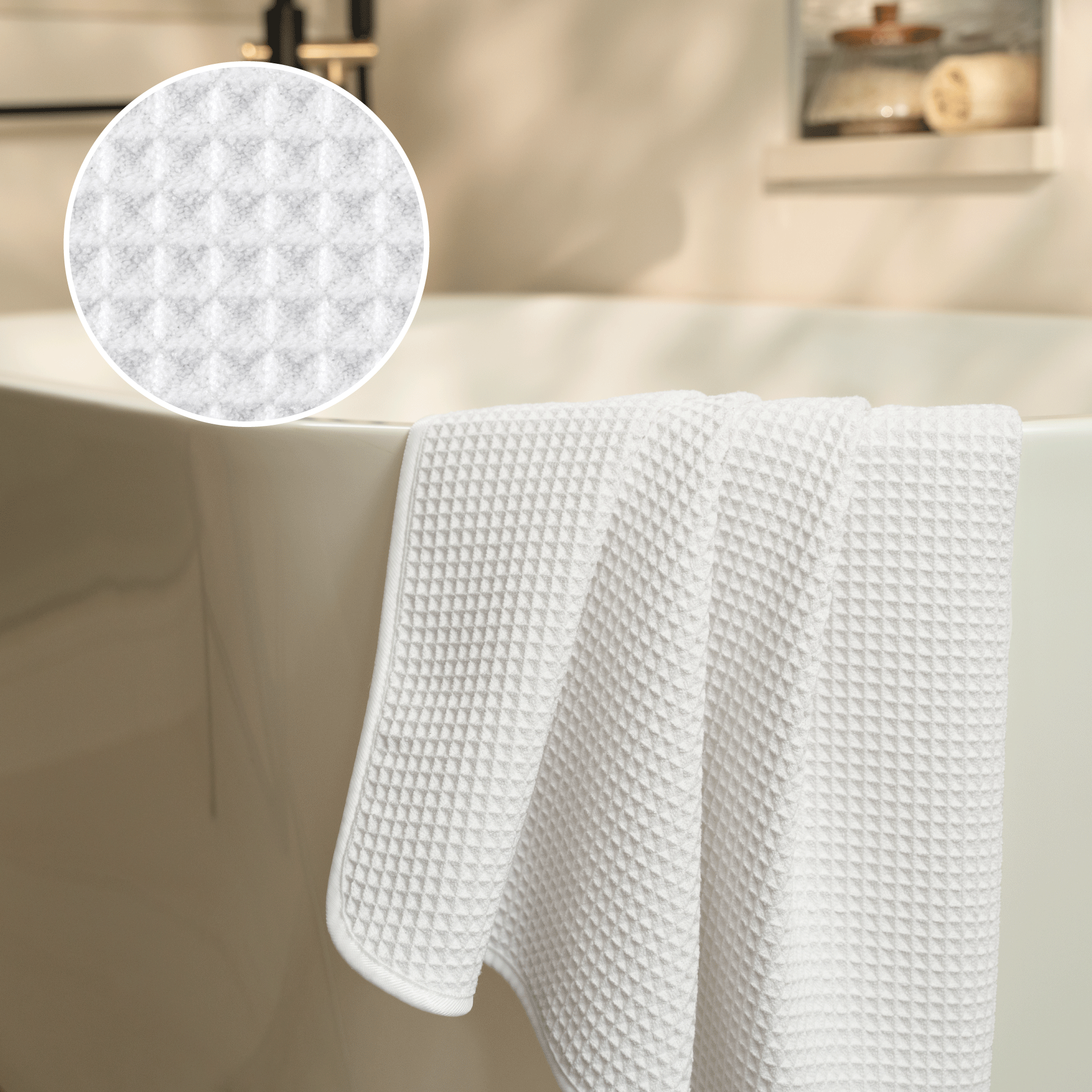 waffle texture shown closely with a white waffle bath towel draped over the side of the tub
